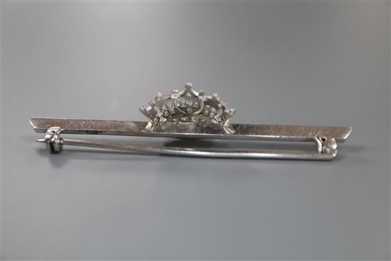 A mid 20th century white metal and diamond set coronet bar brooch, 56mm, gross 5 grams.